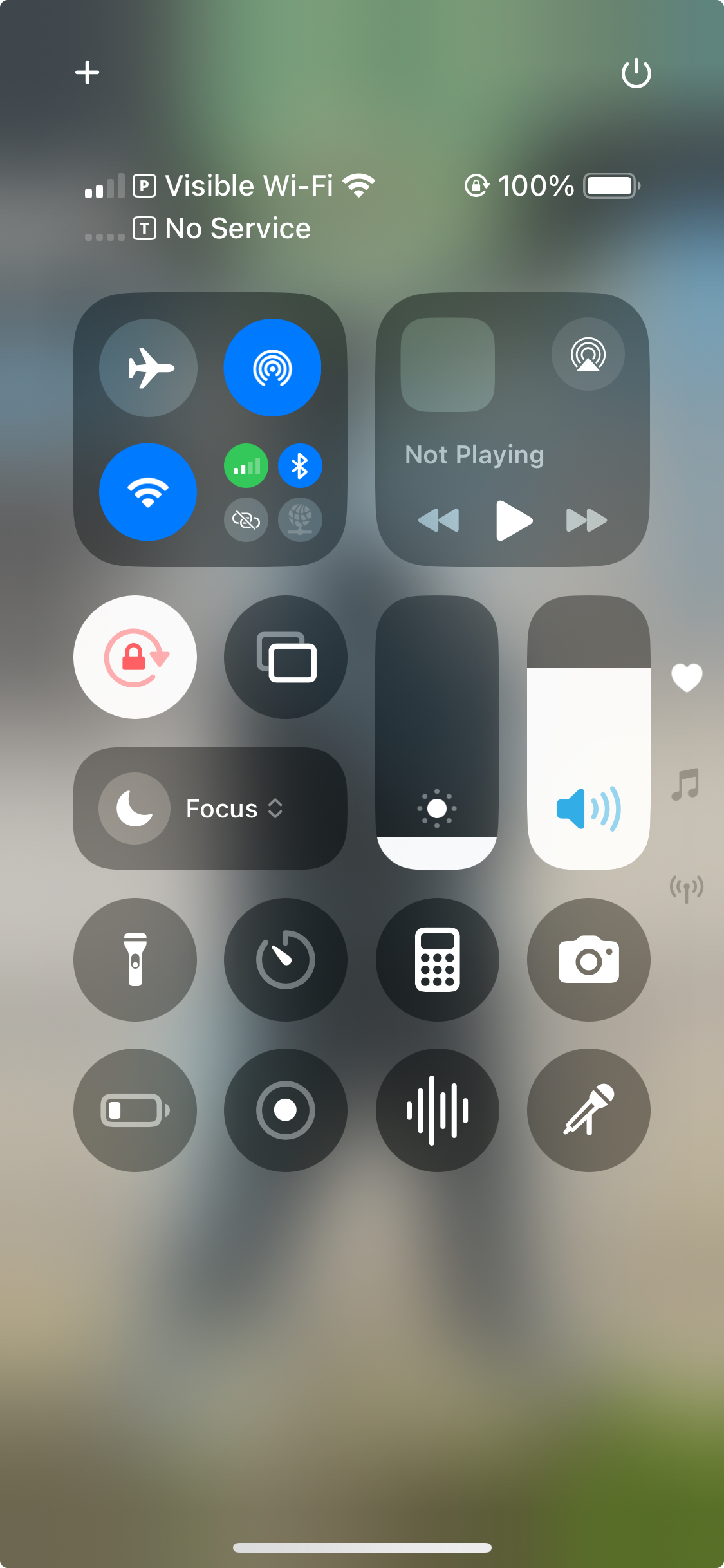 iPhone Lock Screen showing the Voice Memos and Spit Notes recording buttons in the Control Center.
